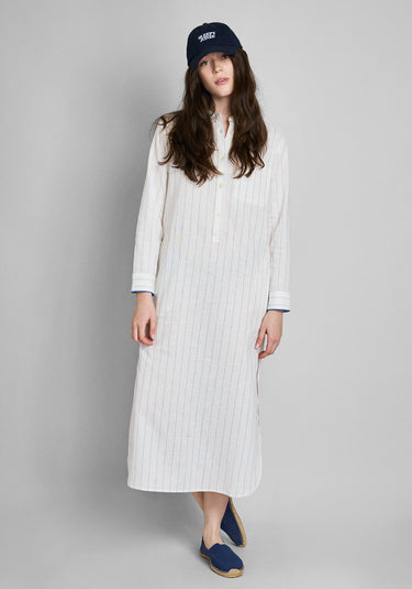 A woman wearing a navy blue baseball cap with 