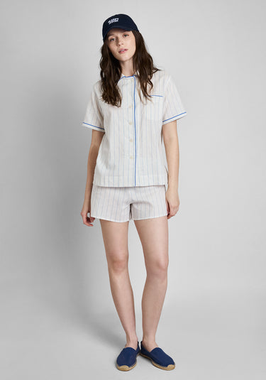 A woman wearing a navy blue baseball cap with 