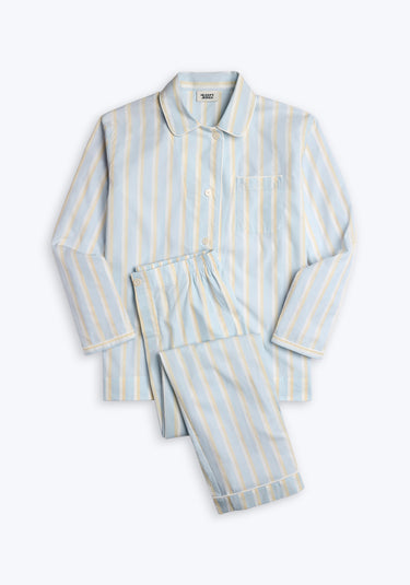 Blue pajama set  with cream and white stripes on a white background