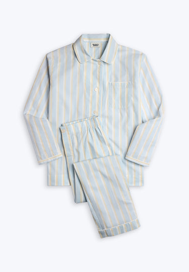 Blue pajama set  with cream and white stripes on a white background