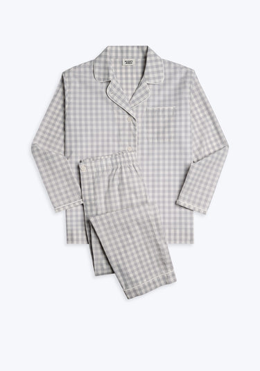 A grey and white gingham pajama set with long sleeves and button-fly pants.
