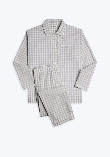 A grey and white gingham pajama set with long sleeves and button-fly pants.
