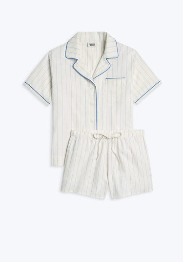 A white and blue striped linen pajama set with short sleeves and elastic waist shorts.